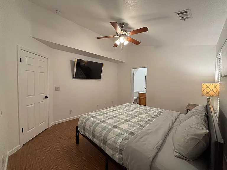 Master bedroom with walk-in closet, new smart TV, and a desk for your working or studying.