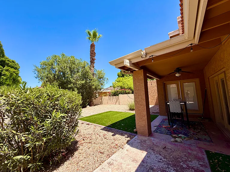 Backyard. Fully fenced, irrigated. Gravel and turf.
