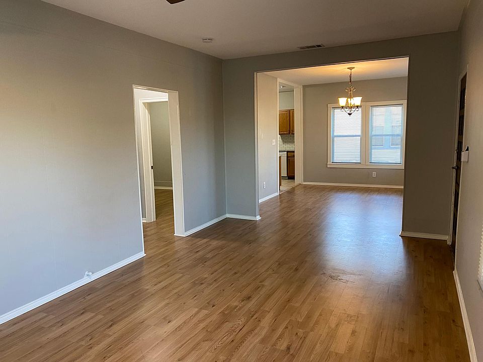 Large and well lit living room.