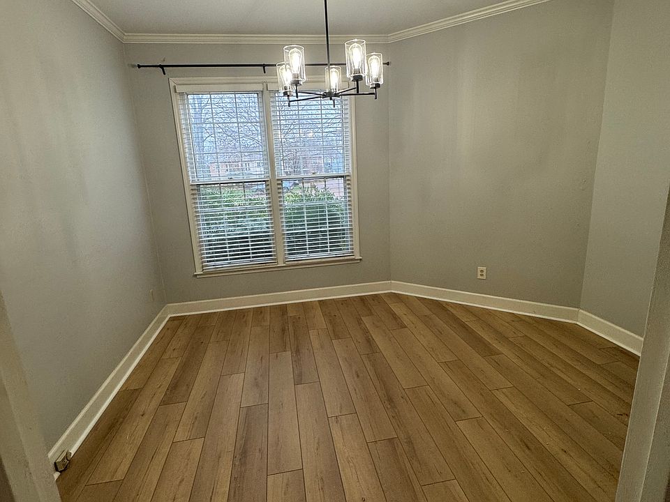 Spacious dining room with updated floors and lighting