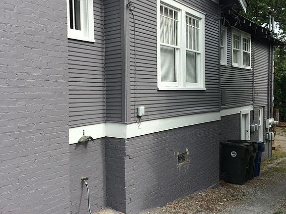 Drive down driveway to parking and entrance to Apartment #3.
