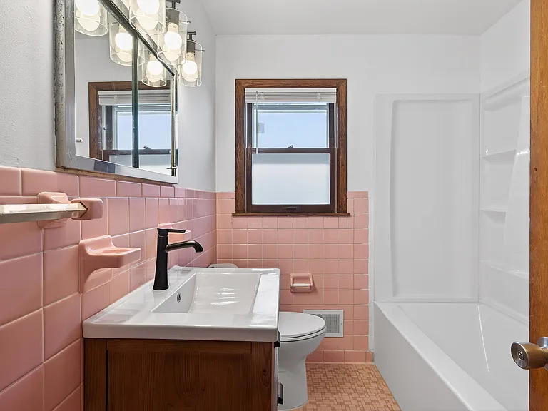 Classic full bathroom includes new bathroom vanity and lights!
