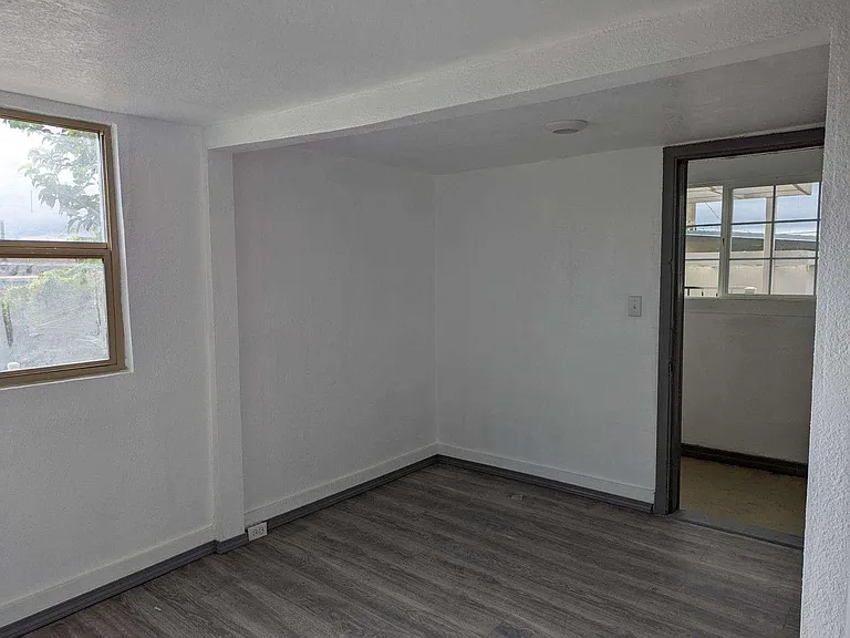 Dining Room Area with access to Enclosed Back Porch with W/D Hookup