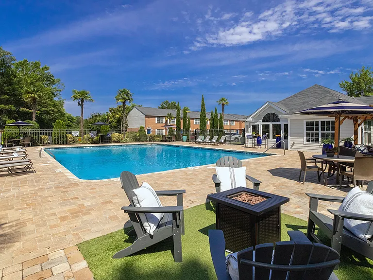 Embrace warmth and ambiance by our inviting poolside fire pit.