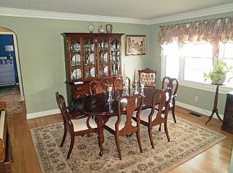 Formal living room w/hardwood floors & crown