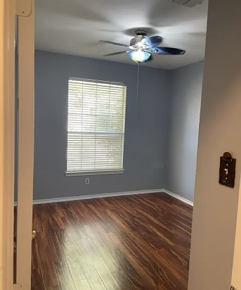 2nd bedroom, ceiling fan, faces front of house.
