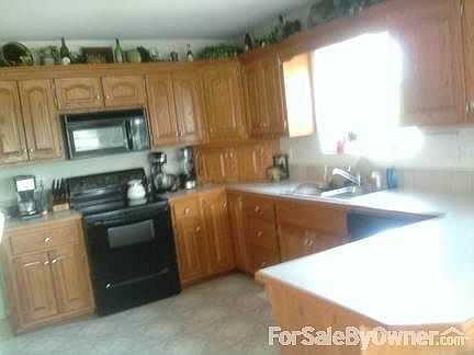 Kitchen
						:
						Custom Oak Cabinets