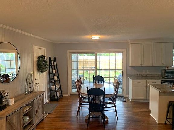 Lots of light and a view to the spacious backyard with tall privacy fence