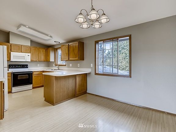 A suitable kitchen space with options for dining or desk.