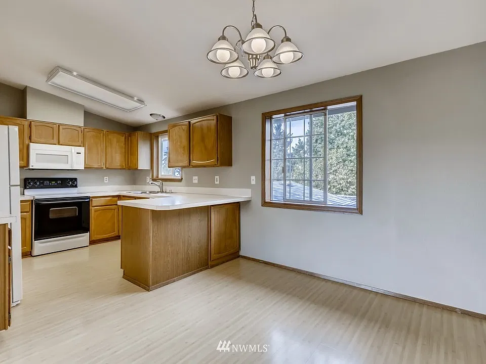 A suitable kitchen space with options for dining or desk.