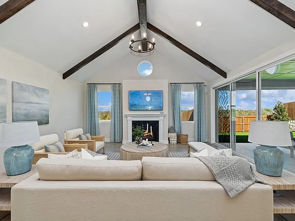 Great room with vaulted ceiling and stained ceiling beams