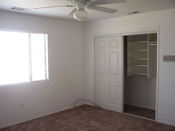 Bedroom with closet organizers