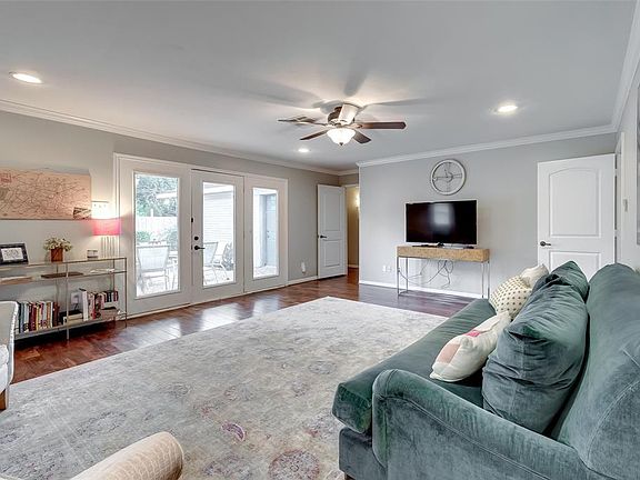 View from Den Looking out at Patio and Door to Hallway Bedrooms. The doors throughout the home are great for cutting out noise.