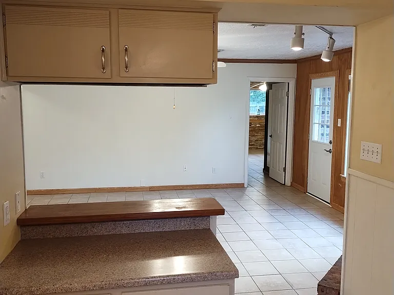 From Kitchen breakfast table area looking into Den.