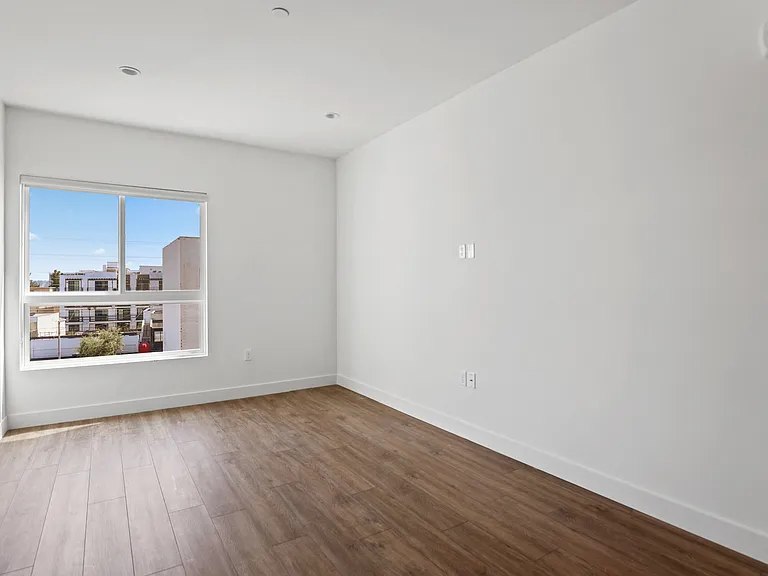 Bedroom with large Windows, Recessed Lighting, and Vinyl Flooring