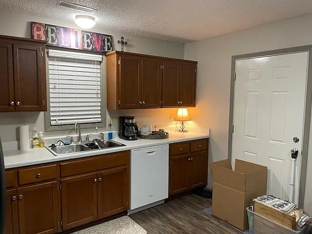 Kitchen: includes dishwasher, stove/oven, microwave, and fridge. Back door. Note: other than appliances, unit is not furnished.