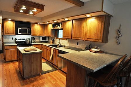 Kitchen - expanded and new in 2005. Breakfast bar, tons of cupboard room, and an island for your con