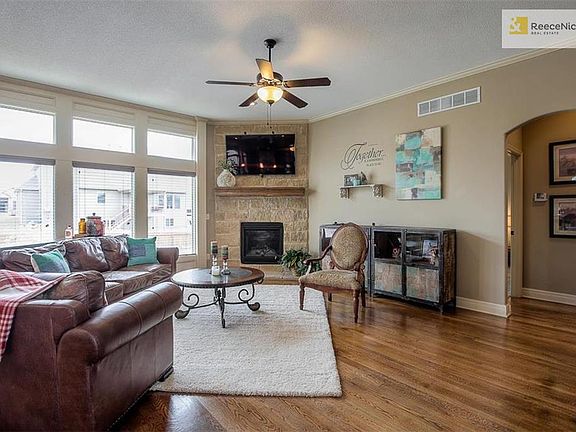 Gather with family and friends in this great room with a warm stone fireplace. The Cypress II floor plan is perfect for entertaining across the main level and out onto the back patio.