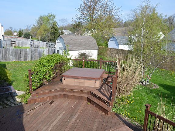 Back of House with Hot Tub