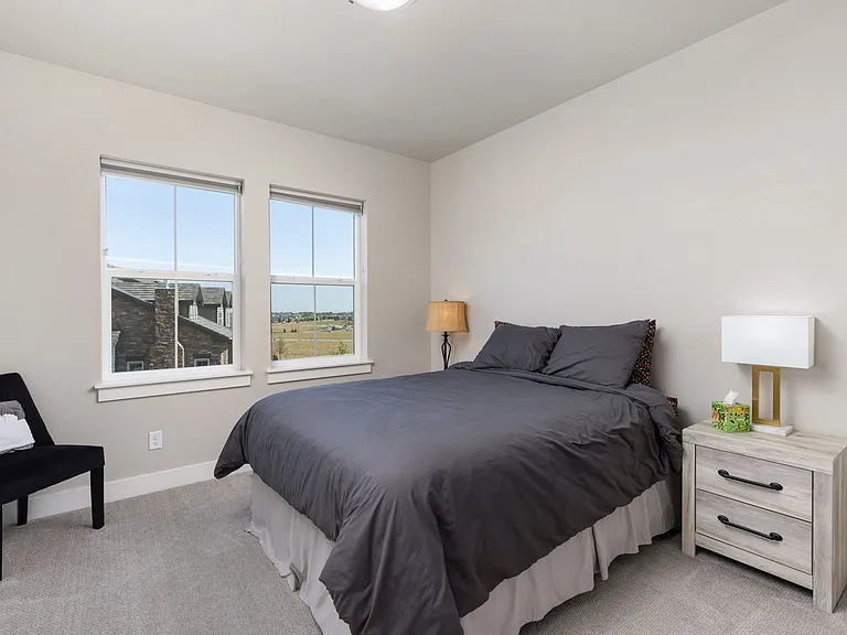 Upstairs bedroom #2 of 4 (furniture pictured is for staging purposes only - unfurnished unit)