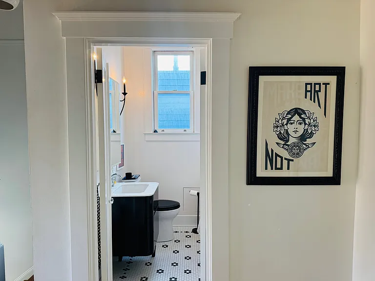 Upstairs bath with clawfoot tub and floating sink/vanity