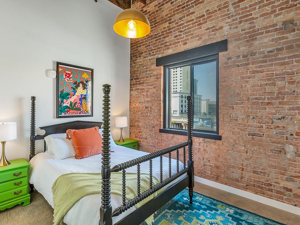 Soaring ceilings, open rafters and a huge window in the master bedroom