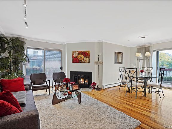 Cozy living room with charming wood-burning fireplace.