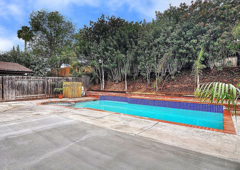 This great backyard is perfect for entertaining & has a sparkling pool & spa!
