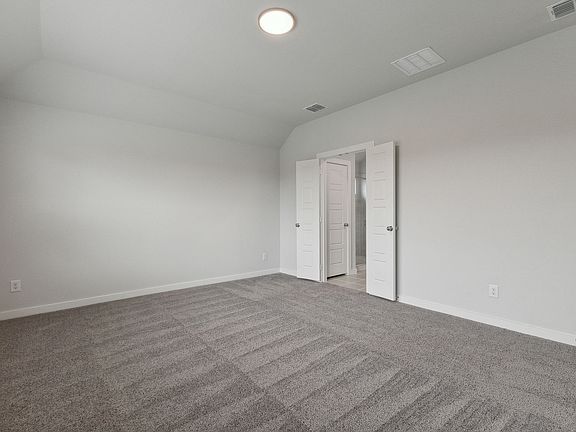 Primary Suite in the Oscar home plan by Trophy Signature Homes - REPRESENTATIVE PHOTO