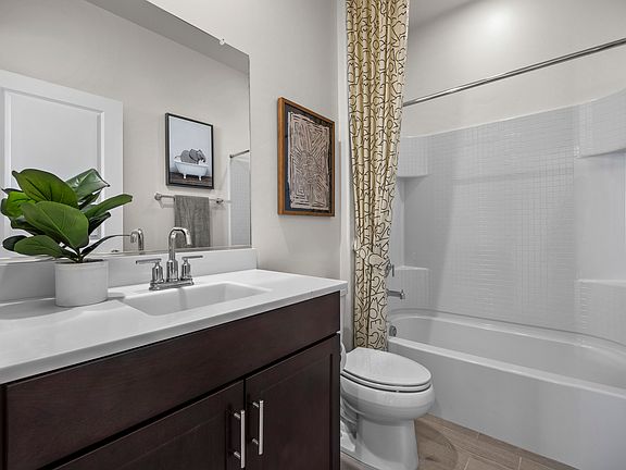 Second bathroom conveniently located between bedrooms two and three.