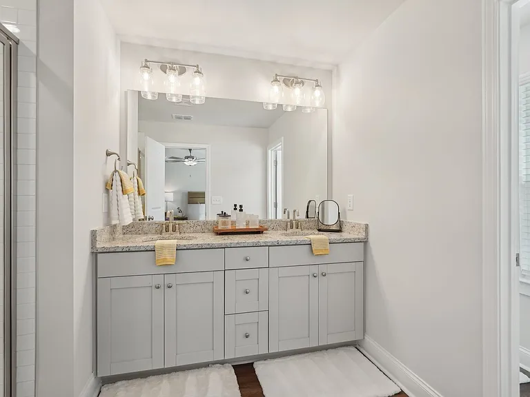 A view of the double vanity and walk in shower.