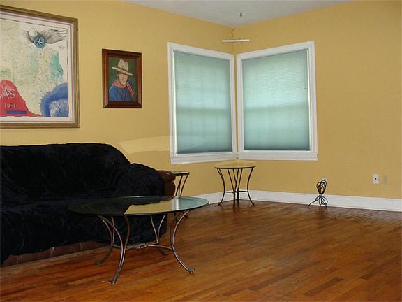 Spacious Living Room with Hardwood Floors
