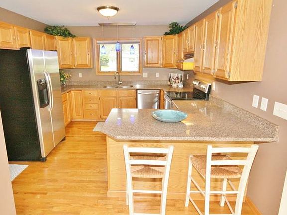 The kitchen has a breakfast bar that comfortably fits two. It makes for a great space to entertain and stay engaged while cooking when friends and family are over.