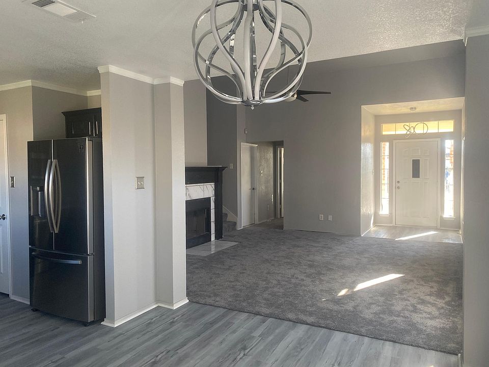 Renovated view from the dining area. Stunning Light Fixtures.