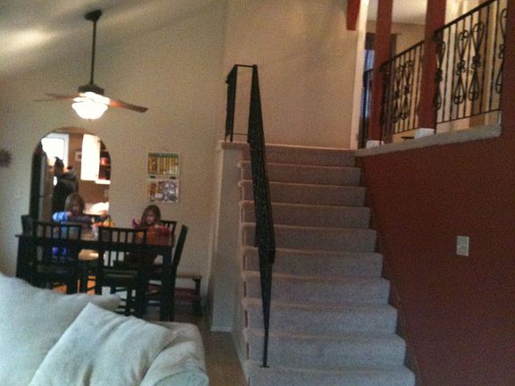 Upstairs Overlooks Dining Area & Living Room