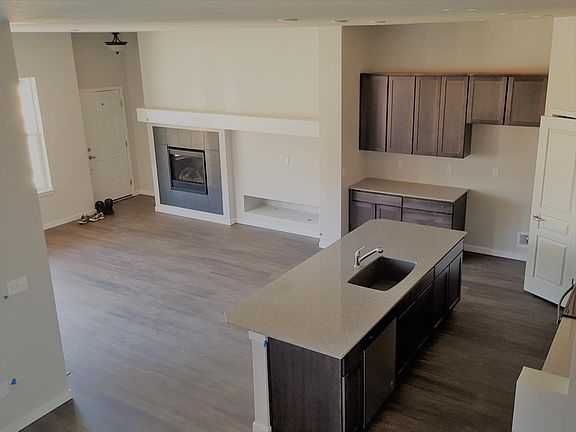 Kitchen from Stairs Gas fireplace in far left corner next to