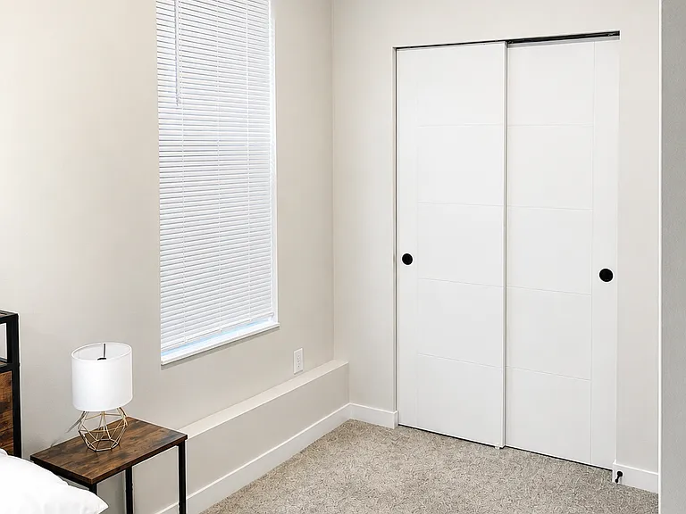 First bedroom downstairs with closet view