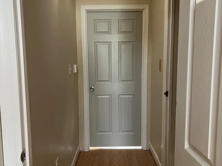 top of steps hallway to bedrooms , thermostat heat/A/C