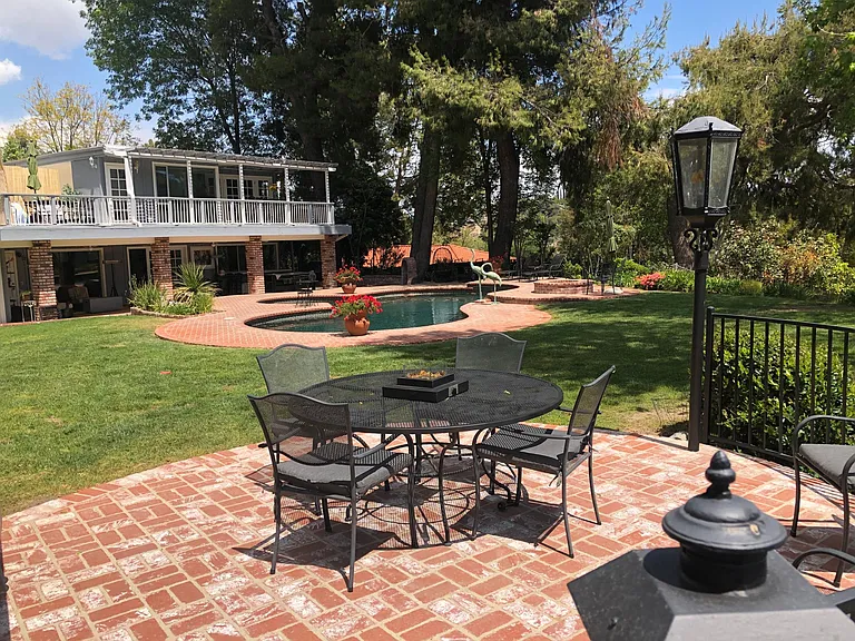 BACKYARD WITH GOLF COURSE VIEW BEHIND PROPERTY