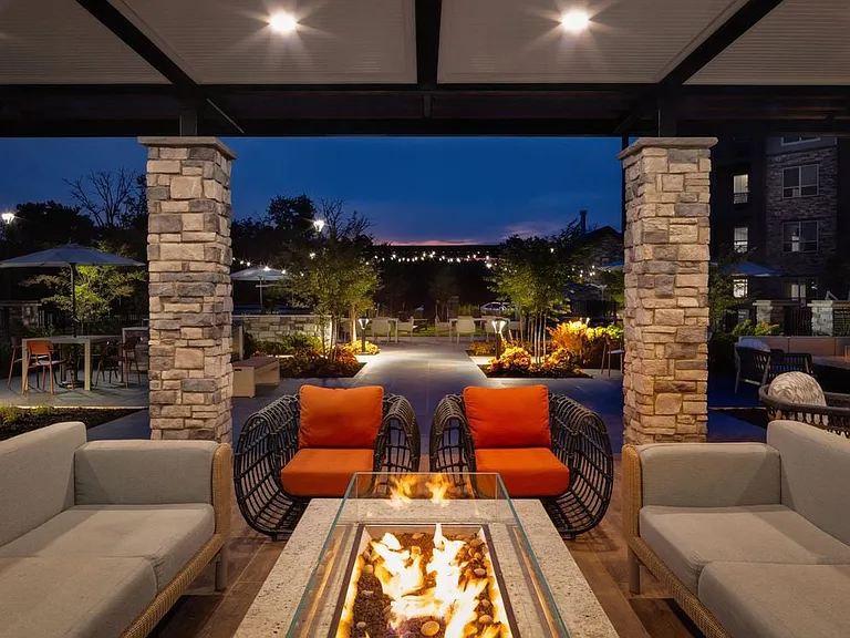 Courtyard with lounge seating and fireplace