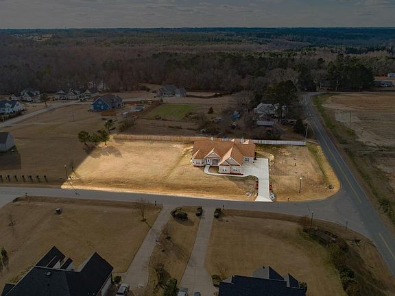 1.04-acre lot with ample open space for future pool, detached garage, or raised garden. 