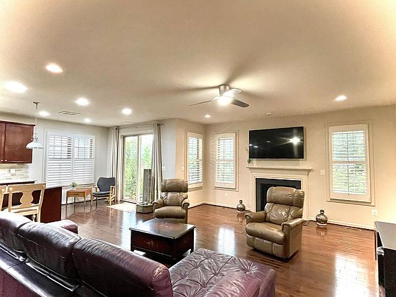 spacious great room. plenty of light. hardwood floors. gas fire place