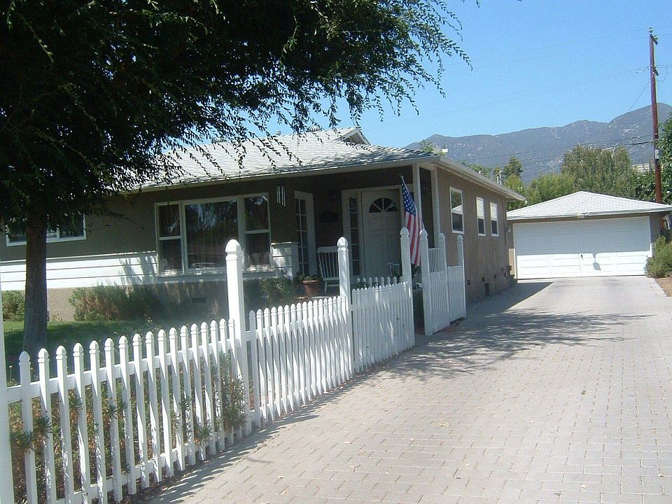 Front of House, new paver driveway, 2 car detached garage with new rollup door