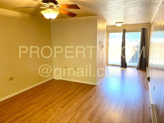 Living room, dining area, patio door.