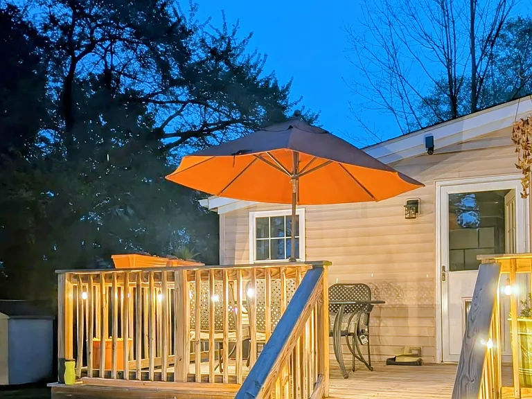 Enjoy the BBQ grill and dine al fresco on the deck overlooking the backyard