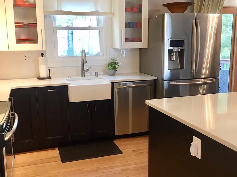 Stainless steel appliances with new dishwasher and French door refrigerator.