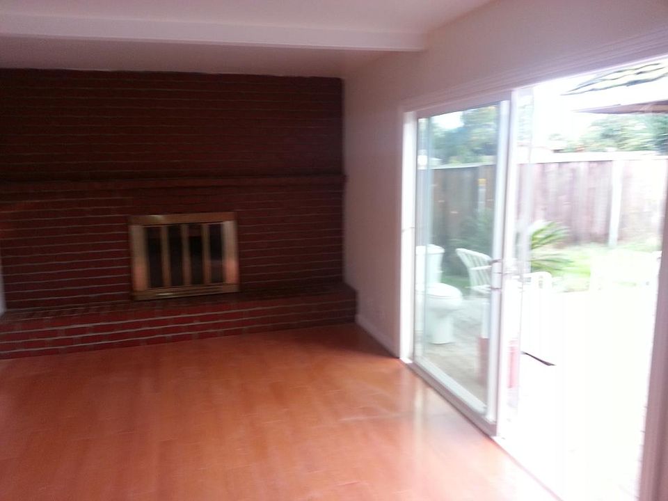 Family room leading to deck in backyard