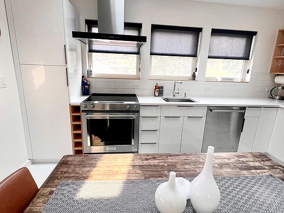 Kitchen windows & skylight looking East to the foothills.