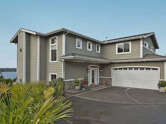 Traditional meets Contemporary as this home, with low maintenace cement planked siding and double in