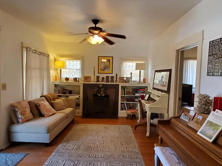 main living area with hardwood floor and fire place